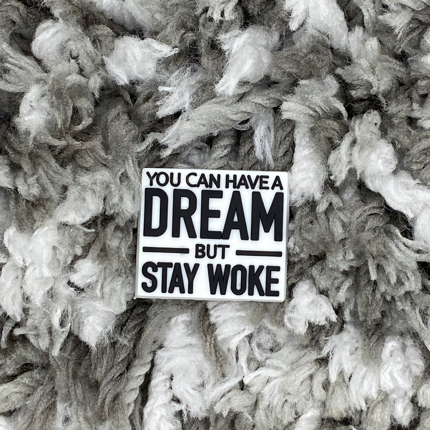 Dream but stay woke